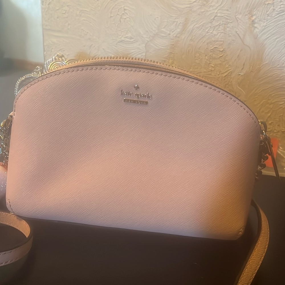 Light pink Kate Spade purse with dust bag. Was a gift no original price tag.